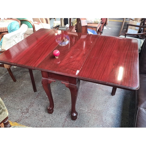 739 - Vintage red mahogany drop-leaf dining table featuring cabriole legs and a rich polished finish. Expa... 