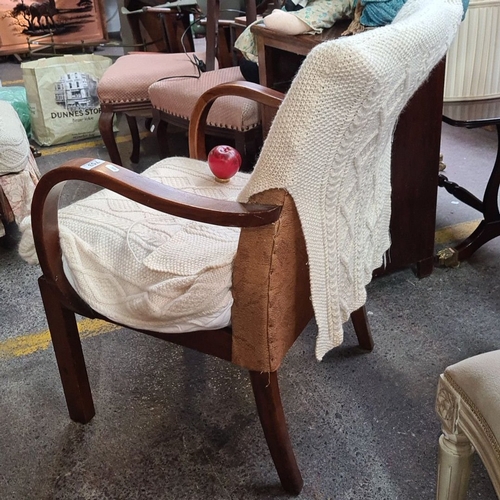 753 - A Vintage wooden armchair with curved armrests and an upholstered seat covered in Arran slip covers.... 