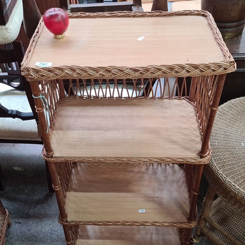 757 - A new Vintage wicker and wood four-tier shelving unit. Handwoven rattan frame with wooden shelves.