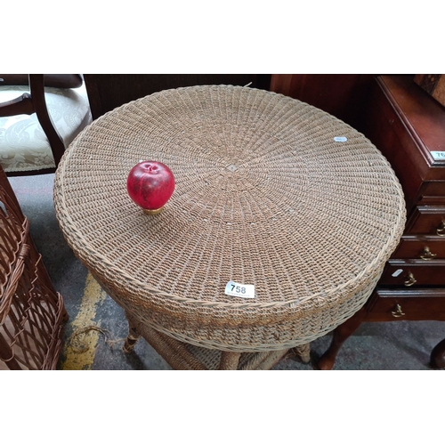 758 - Vintage woven wicker side table with round top and lower shelf.