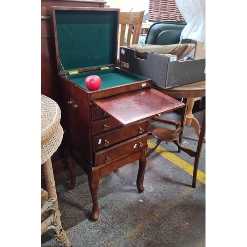 760 - Mahogany Georgian-style Davenport neat size  writing cabinet features a hinged top, fitted interior,... 