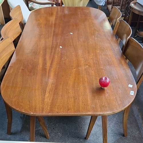 774 - Star Lot : A Mid century Danish style teak dining table with six matching teak chairs, with curved l... 