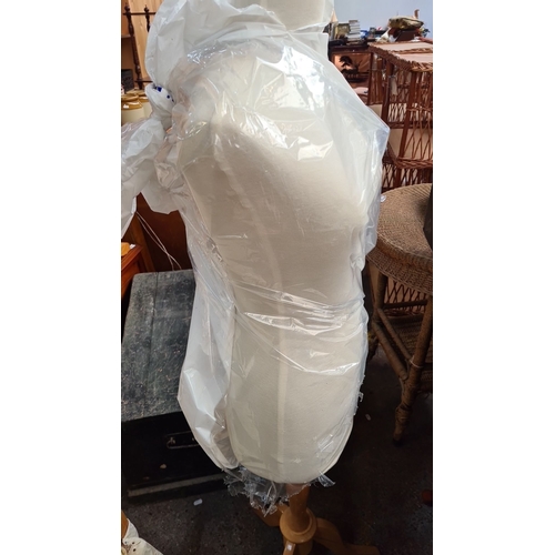 776 - Vintage adjustable dressmaker’s mannequin on a wooden tripod stand, covered in fabric. Wrapped in pr... 