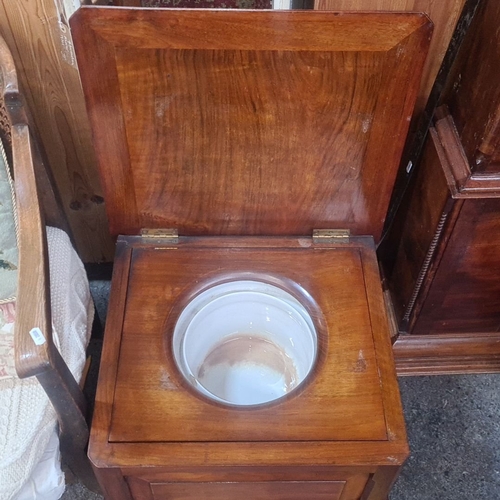 782 - A handsome Victorian mahogany commode cabinet, late 19th century, with upholstered top and original ... 