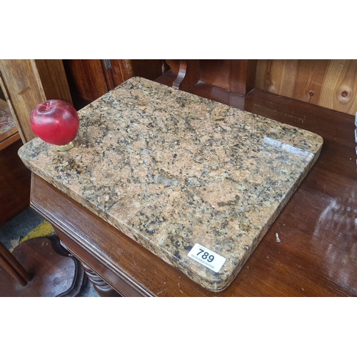 789 - A heavy Granite chopping board with polished finish, featuring a mottled beige and black pattern.