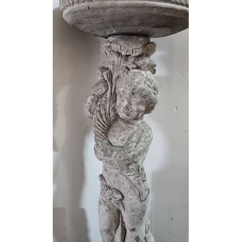 902 - Star lot :A Cast stone garden bird bath features a cherub pedestal base with intricate detailing.