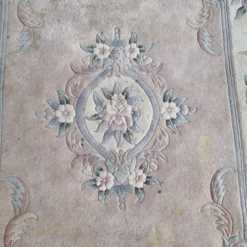 916 - A Chinese Handwoven floral-pattern area rug with pastel tones and intricate detailing. Features a ce... 