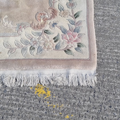 916 - A Chinese Handwoven floral-pattern area rug with pastel tones and intricate detailing. Features a ce... 