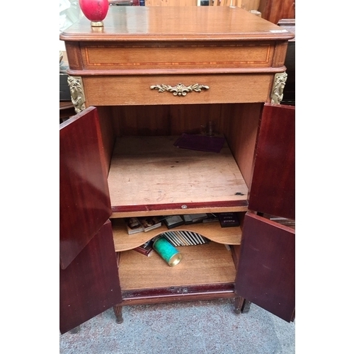 732 - Empire Style mahogany Gramophone  cabinet with brass ormolu mounts and inlaid details. Features dual... 