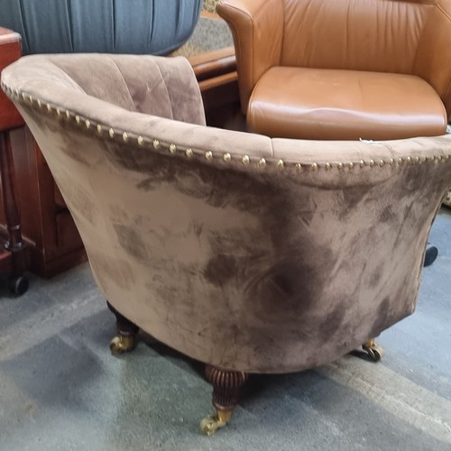 1316 - Star Lot : A designer velvet accent chair with scalloped backrest and brass nailhead trim. Supported... 