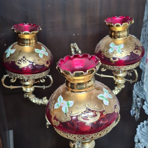 967 - Star Lot: A striking Venetian glass banquet lamp featuring cranberry glass, gilded accents, and hand... 