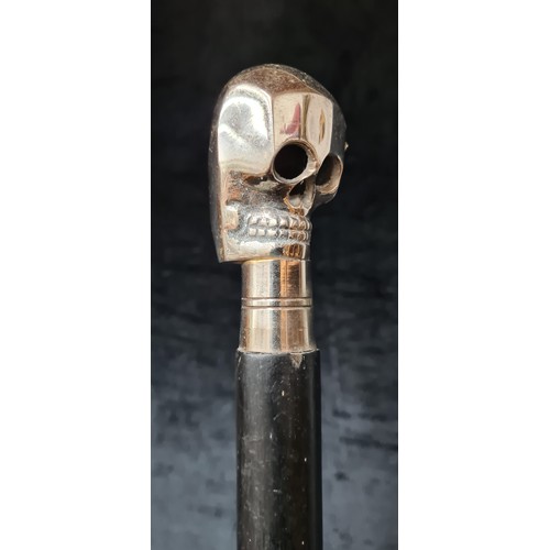 1016 - A vintage walking cane featuring a chrome skull handle.