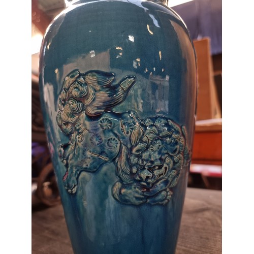 497 - Star Lot : An antique Chinese heavy example of a striking blue glazed ceramic vase with raised relie... 