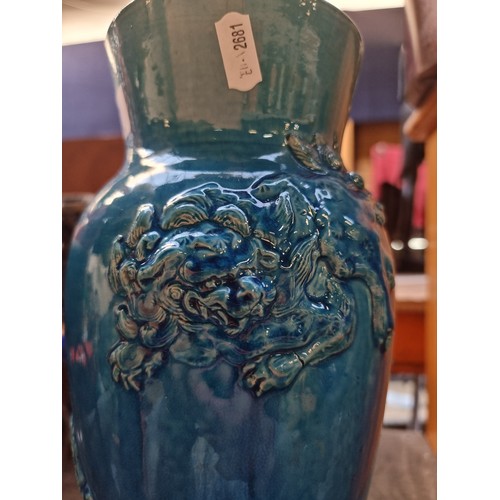 497 - Star Lot : An antique Chinese heavy example of a striking blue glazed ceramic vase with raised relie... 