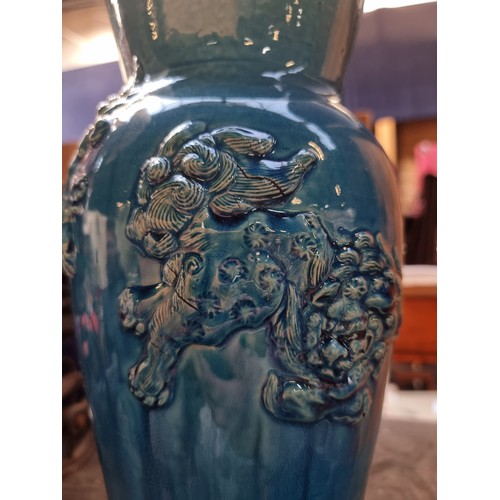 497 - Star Lot : An antique Chinese heavy example of a striking blue glazed ceramic vase with raised relie... 