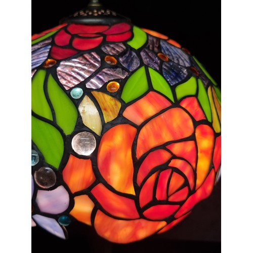 124 - Star Lot : A very pretty, tall Tiffany style table lamp featuring a colourful stained glass domed sh... 