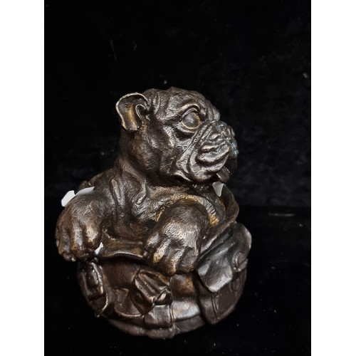 198 - Star Lot : A heavy brass sculptural piece of a dog poking out of a bag.