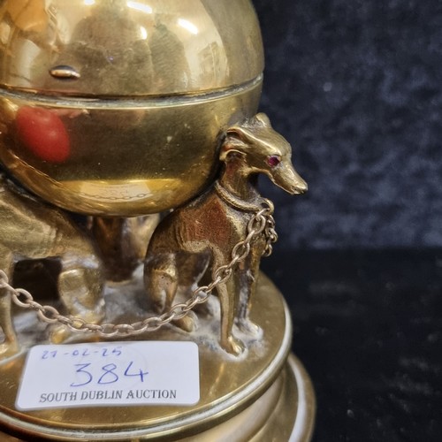 384 - Star Lot: A fine antique Victorian brass inkwell which takes the form of three chained whippets with... 