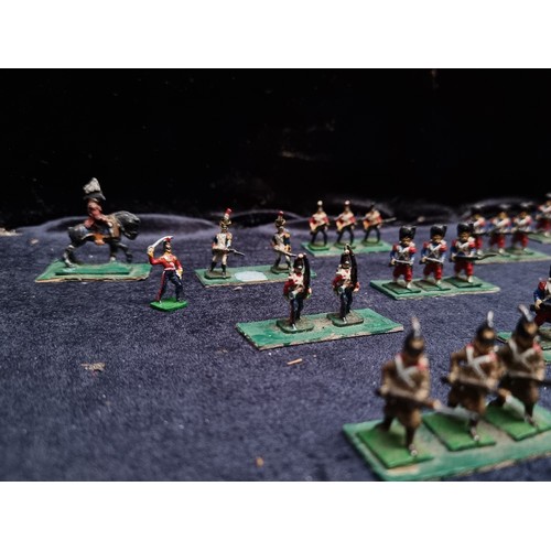 315 - A wooden box containing 22 sets of hand painted lead soldiers.