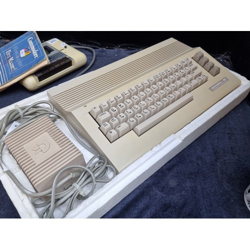 324 - A vintage Commodore 64 personal Computer with cassette player and User Manual, With the original box... 