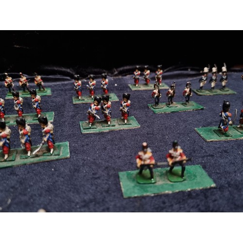 315 - A wooden box containing 22 sets of hand painted lead soldiers.