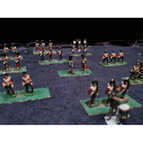 315 - A wooden box containing 22 sets of hand painted lead soldiers.