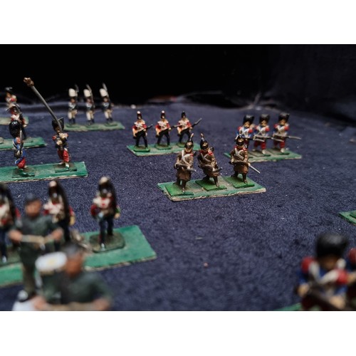 315 - A wooden box containing 22 sets of hand painted lead soldiers.