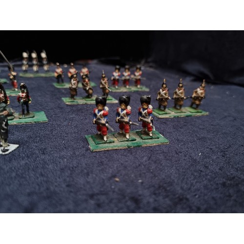 315 - A wooden box containing 22 sets of hand painted lead soldiers.