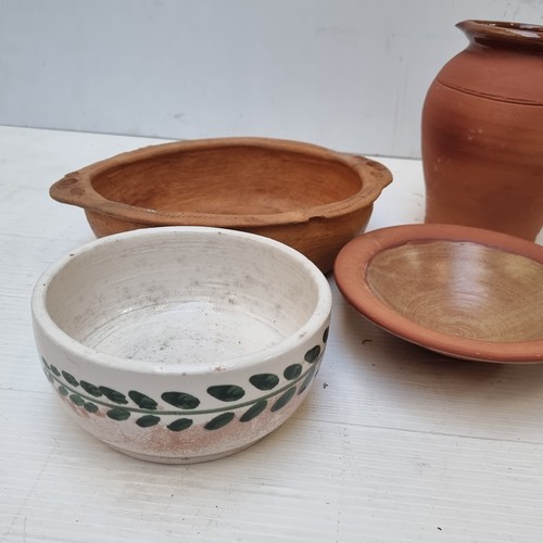 351 - A crate containing a large selection of terracotta homeware including bowls, pitcher jug and cups.