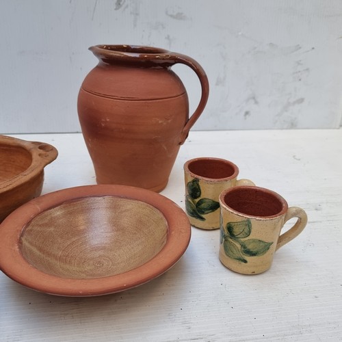 351 - A crate containing a large selection of terracotta homeware including bowls, pitcher jug and cups.