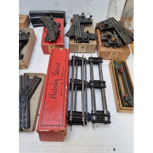 406 - A large quantity of vintage model railway track and accessories. Includes 14 boxes of Hornby series ... 