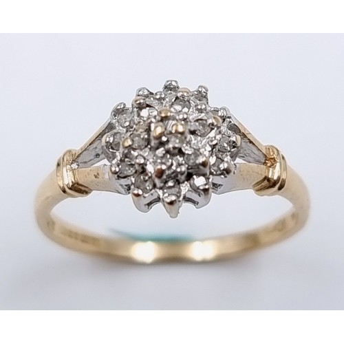 2 - Star Lot : A pretty nine carat gold diamond cluster ring. Ring size -  L. Weight - 1.66 grams.