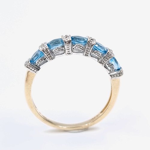 3 - Star Lot : A beautiful diamond and topaz eternity ring set in nine carat gold. Weight - 2.2 grams. S... 