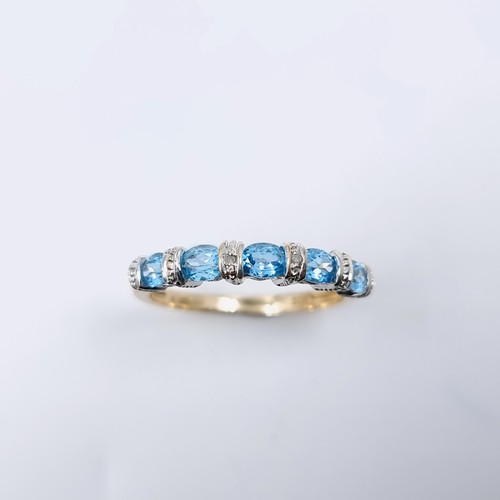 3 - Star Lot : A beautiful diamond and topaz eternity ring set in nine carat gold. Weight - 2.2 grams. S... 