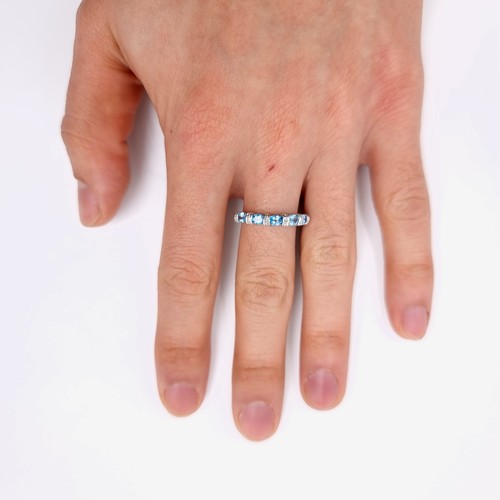 3 - Star Lot : A beautiful diamond and topaz eternity ring set in nine carat gold. Weight - 2.2 grams. S... 