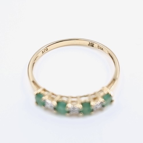 4 - Star Lot : A lovely diamond and emerald ring set in nine carat gold. Weight -1.17 grams. Size - P.