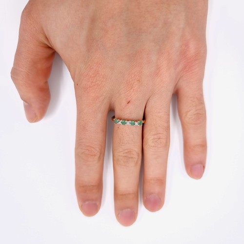 4 - Star Lot : A lovely diamond and emerald ring set in nine carat gold. Weight -1.17 grams. Size - P.