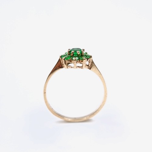 11 - A nine carat gold green topaz  gemstone cluster ring. Size - M. Weight - 1.13 grams.