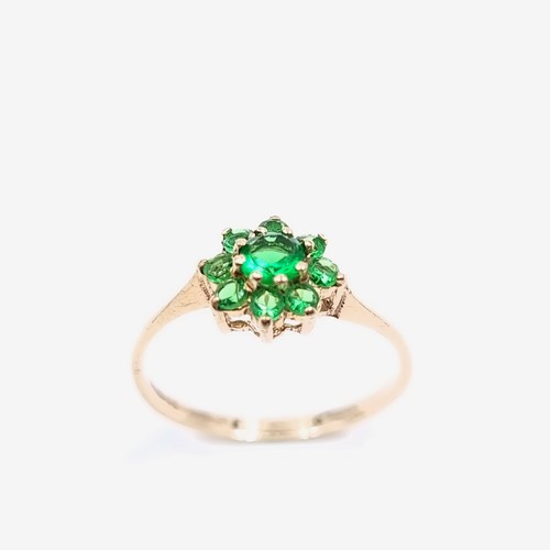 11 - A nine carat gold green topaz  gemstone cluster ring. Size - M. Weight - 1.13 grams.