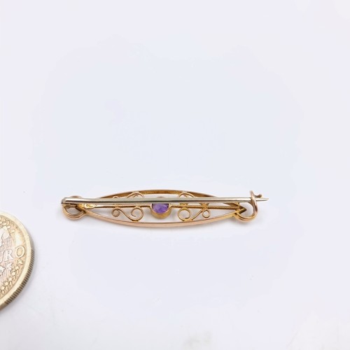 41 - An amethyst nine carat gold stone brooch. Weight - 2.05 grams. Length - 4 cms. closing pin not gold.