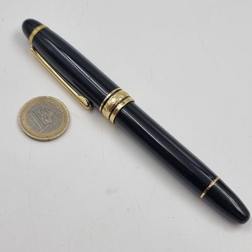 55 - Star Lot : A very nice example of a Mont Blanc fountain pen set with iridium with black body & gold ... 