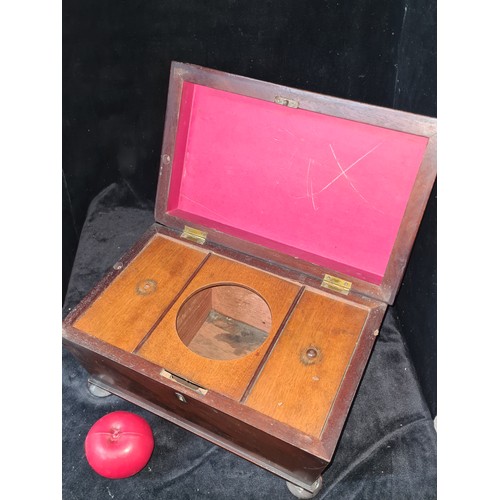 1054 - Star Lot : A handsome Victorian Mahogany tea caddy featuring bun feet.