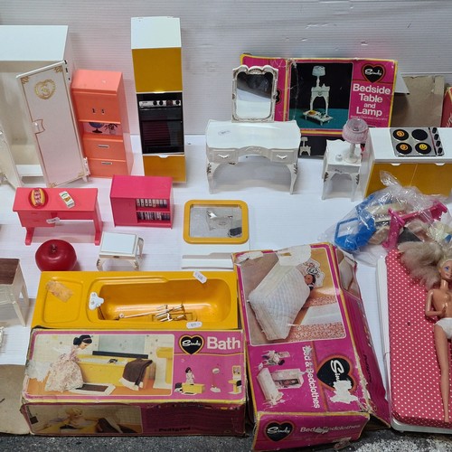 1153 - A Vintage plastic dollhouse furniture lot features mid-century style cabinets, vanities, and storage... 