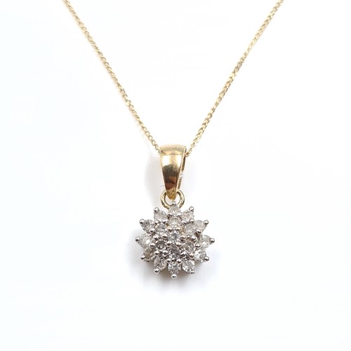 8 - Star Lot : A nine carat gold diamond cluster pendant & chain. Length of chain - 42 cms. Weight - 1.1... 