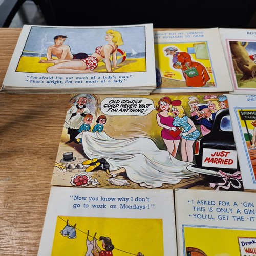 594 - A collection of over 50 vintage coloured 'Sea side' comedy postcards in good clean condition. Saucy.