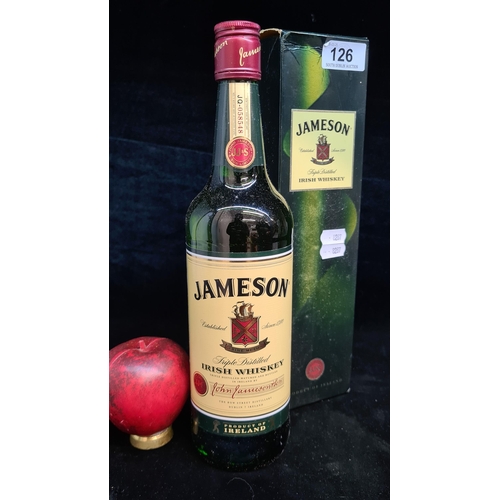 126 - A sealed 700ml bottle of Jameson Irish Whiskey. Complete in original presentation box.