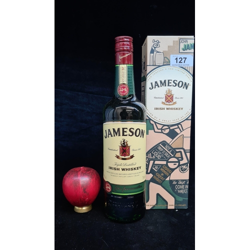 127 - A sealed 700ml bottle of Jameson Irish Whiskey. Complete in original presentation box.