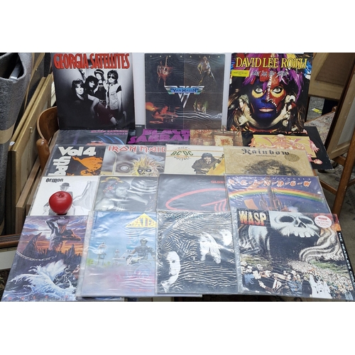 A collection of 15 vintage Heavy Metal vinyl records featuring various ...