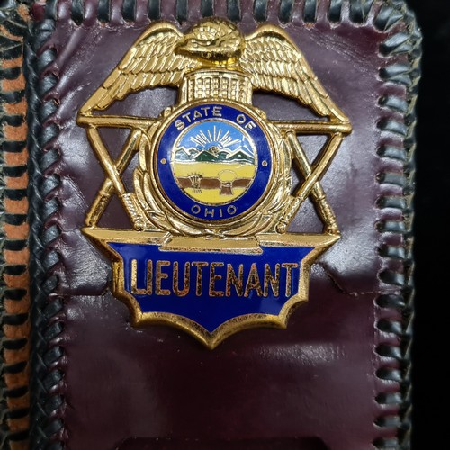 115 - A mixed lot of three items including a leather wallet with a State of Ohio Lieutenant police badge, ... 