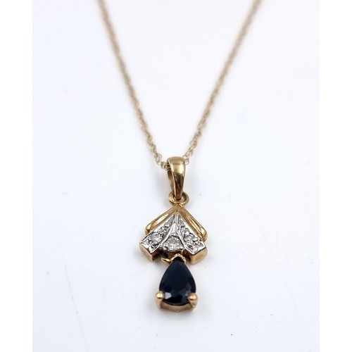 9 - A nine carat gold sapphire and diamond pendant necklace. Length of chain - 46cm. Weight - 1.3 grams.... 